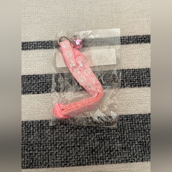 Collar with White Paw Print Pattern and Matching Bell and Buckle - Picture 14 of 15